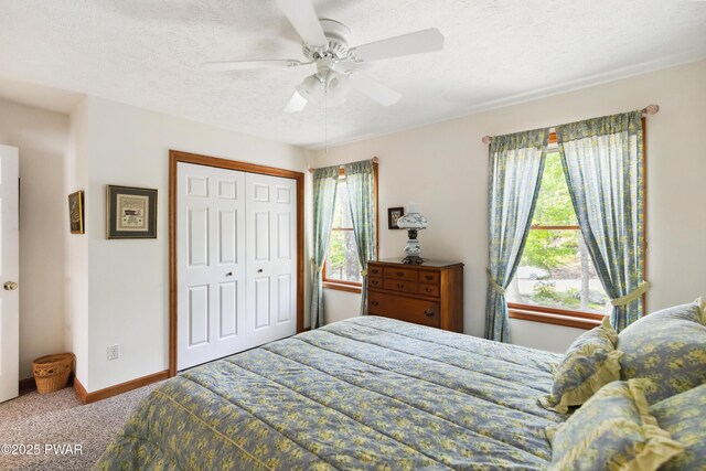 119 Canoebrook Dr, Hawley, PA 18428 - carpeted bedroom featuring a textured ceiling, ceiling fan, a closet, and baseboards