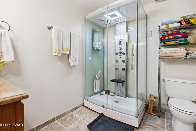 119 Canoebrook Dr, Hawley, PA 18428 - full bath with a shower stall, vanity, stone tile flooring, toilet, and baseboards