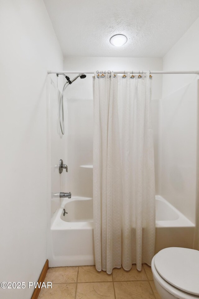 119 Canoebrook Dr, Hawley, PA 18428 - bathroom with shower / tub combo, toilet, a textured ceiling, and tile patterned flooring