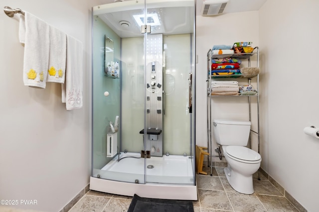 119 Canoebrook Dr, Hawley, PA 18428 - bathroom with stone tile floors, baseboards, and a shower stall