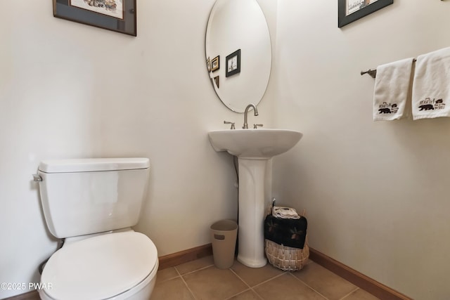 119 Canoebrook Dr, Hawley, PA 18428 - half bath with toilet, baseboards, and tile patterned floors