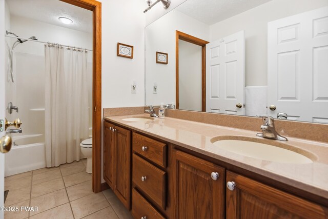 119 Canoebrook Dr, Hawley, PA 18428 - bathroom with toilet, double vanity, tile patterned floors, and shower / bath combination with curtain
