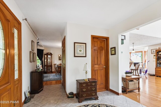 119 Canoebrook Dr, Hawley, PA 18428 - hallway featuring baseboards and light tile patterned flooring