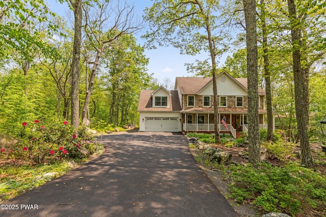 119 Canoebrook Dr, Hawley, PA 18428 - view of front of property with a porch, driveway, and a garage