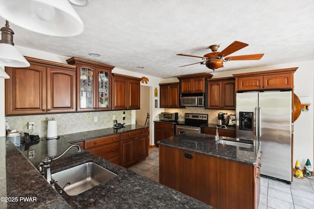 119 Canoebrook Dr, Hawley, PA 18428 - kitchen featuring stainless steel appliances, a sink, light tile patterned flooring, and ceiling fan
