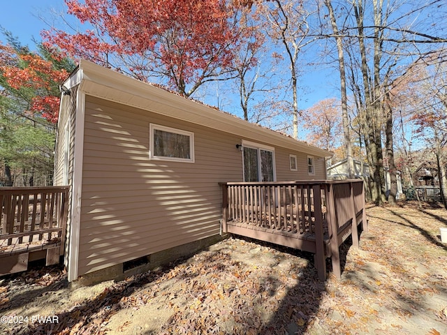 view of side of home featuring a deck