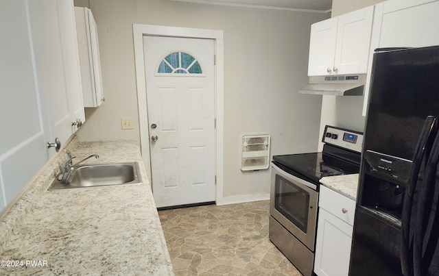 kitchen featuring black fridge, heating unit, sink, electric stove, and white cabinetry