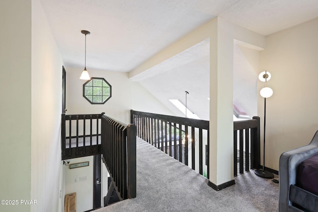 stairs with carpet floors, baseboards, and beam ceiling