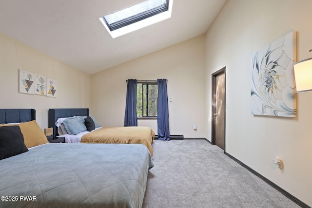 bedroom featuring baseboards, carpet, and lofted ceiling with skylight