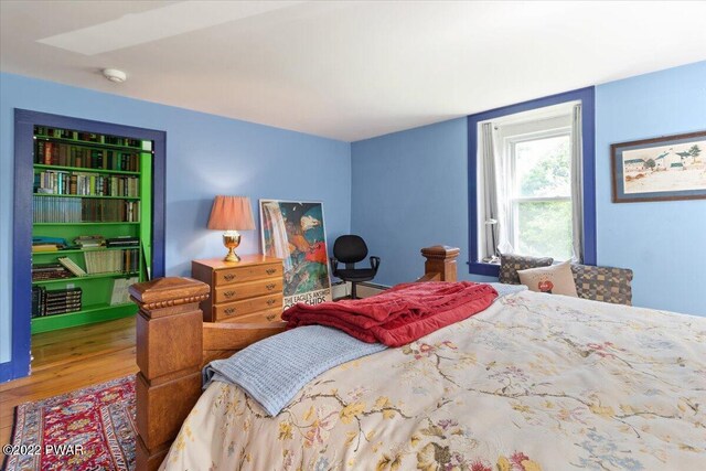 bedroom featuring wood-type flooring