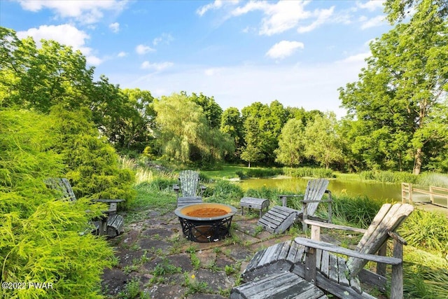 view of patio / terrace with an outdoor fire pit