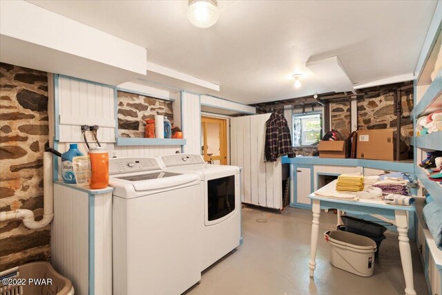 clothes washing area featuring washer and clothes dryer