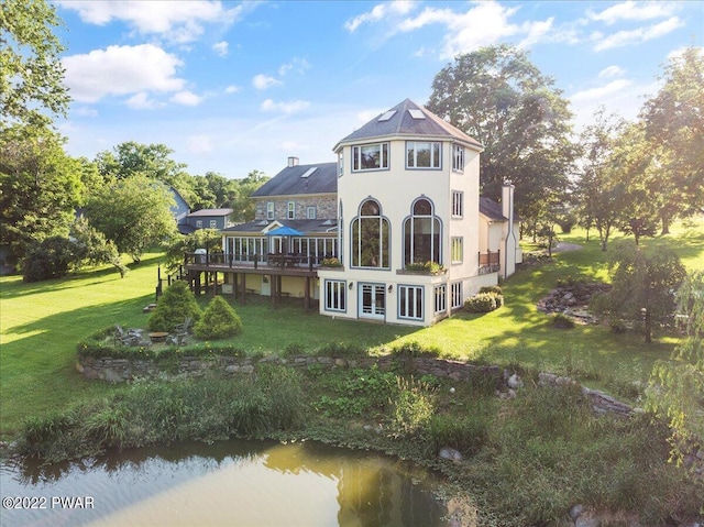 1118 Belvidere Corner Rd, Upper Mount Bethel, PA 18343 - rear view of property featuring a deck with water view and a lawn