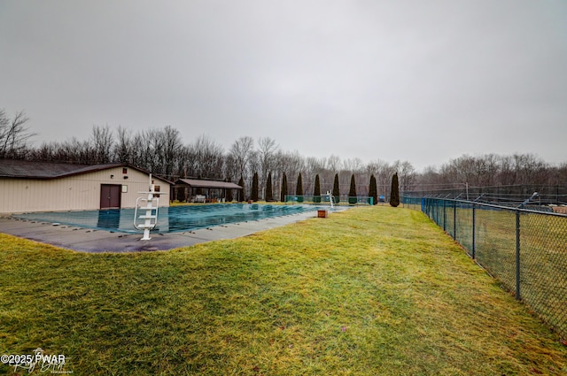 view of pool with a yard, fence, and a fenced in pool