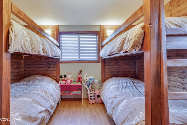 bedroom with wood finished floors