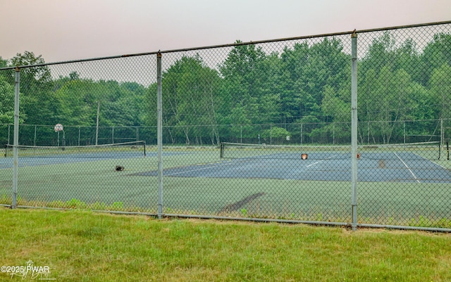 view of sport court with fence