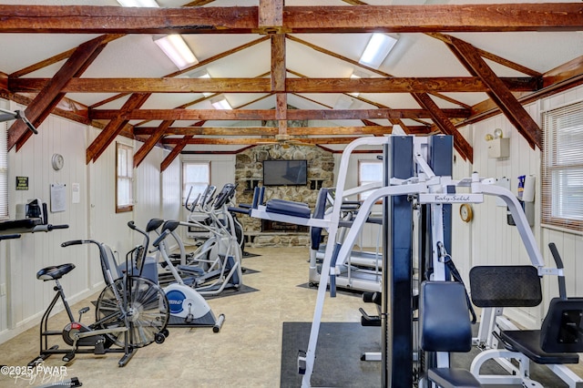 gym featuring vaulted ceiling