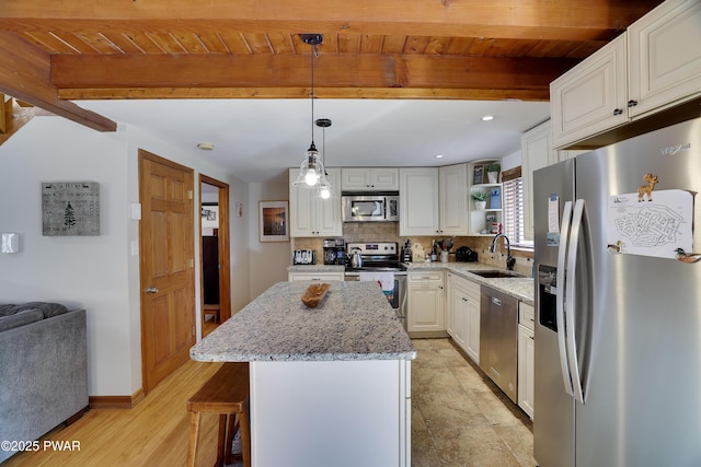 kitchen featuring wood ceiling, open shelves, a sink, beamed ceiling, and stainless steel appliances