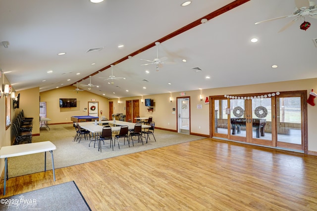 dining area featuring baseboards, a ceiling fan, and lofted ceiling