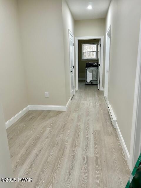 105 Whipple Way, Milford, PA 18337 - hall featuring light wood-type flooring, a baseboard radiator, and baseboards