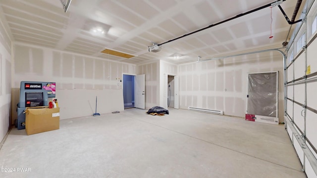 105 Whipple Way, Milford, PA 18337 - garage with a baseboard heating unit and a garage door opener