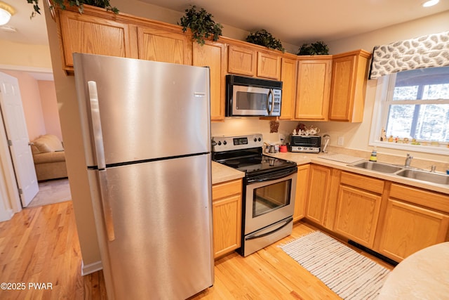 92 Thornwood Ter, Lake Ariel, PA 18436 - kitchen featuring light countertops, recessed lighting, light wood-type flooring, stainless steel appliances, and a sink