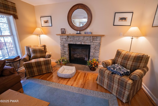 92 Thornwood Ter, Lake Ariel, PA 18436 - living area featuring a stone fireplace, baseboards, and wood finished floors