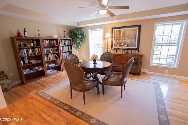 92 Thornwood Ter, Lake Ariel, PA 18436 - dining area with a baseboard radiator, a ceiling fan, baseboards, and wood finished floors