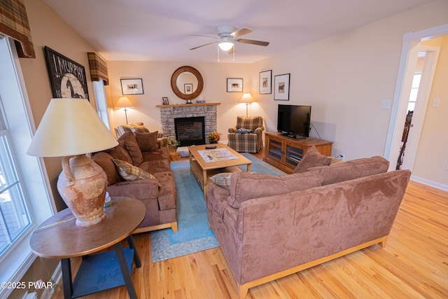 92 Thornwood Ter, Lake Ariel, PA 18436 - living area featuring a fireplace, a ceiling fan, baseboards, and light wood-type flooring