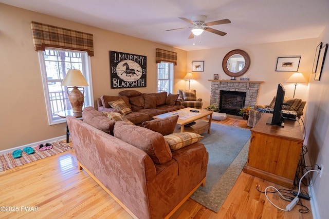 92 Thornwood Ter, Lake Ariel, PA 18436 - living area featuring ceiling fan, a healthy amount of sunlight, a fireplace, and wood finished floors