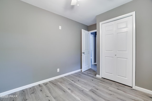 146 Country Club Dr, Thornhurst, PA 18424 - unfurnished bedroom with light wood finished floors, a closet, and a ceiling fan