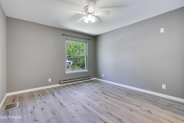 146 Country Club Dr, Thornhurst, PA 18424 - spare room with baseboard heating, wood finished floors, and ceiling fan