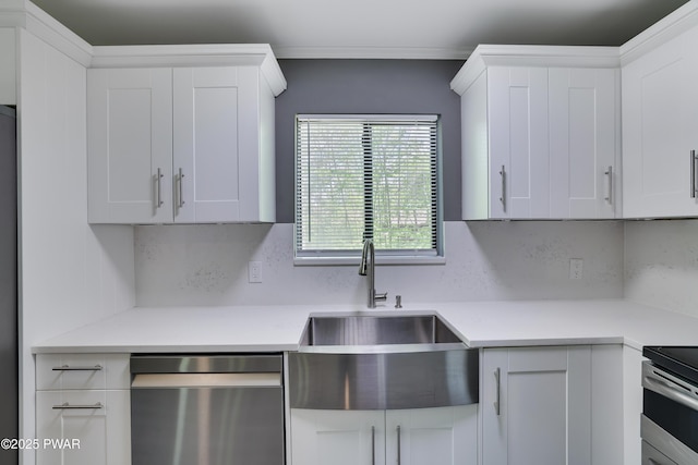 146 Country Club Dr, Thornhurst, PA 18424 - kitchen with appliances with stainless steel finishes, light countertops, white cabinets, and ornamental molding