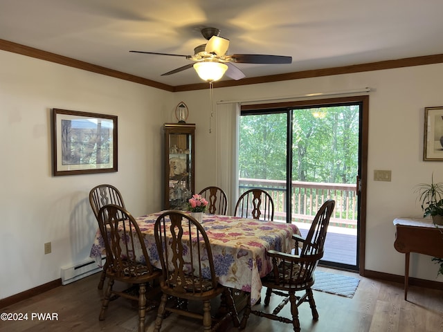 dining space with wood-type flooring, baseboard heating, ceiling fan, and ornamental molding