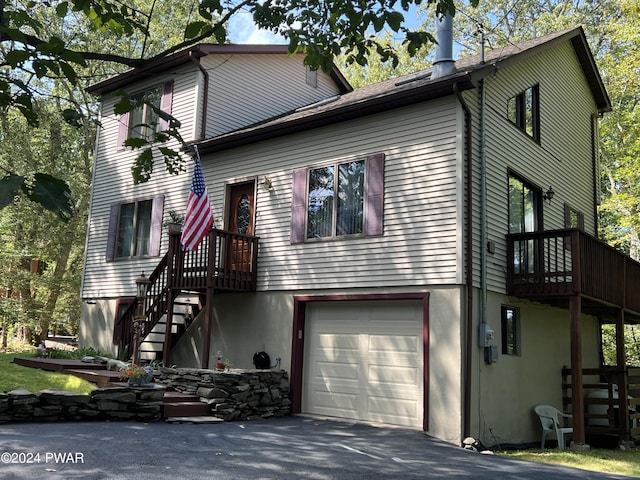 view of front of property with a balcony and a garage