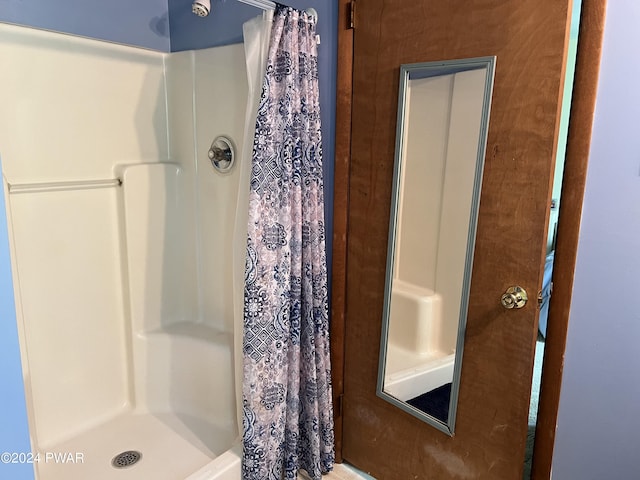 bathroom with a shower with curtain