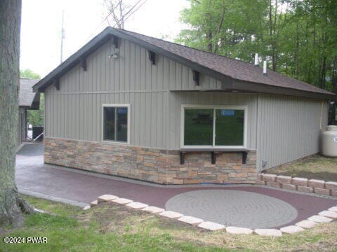 view of side of property with a patio