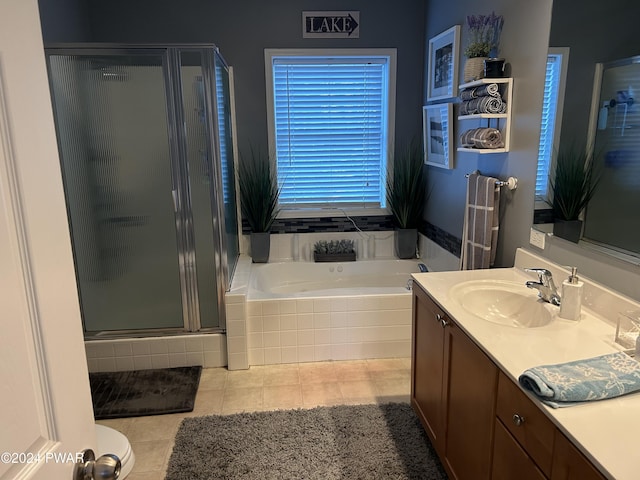 bathroom featuring vanity, tile patterned floors, and independent shower and bath