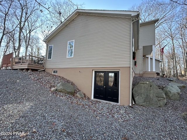 rear view of property with a deck