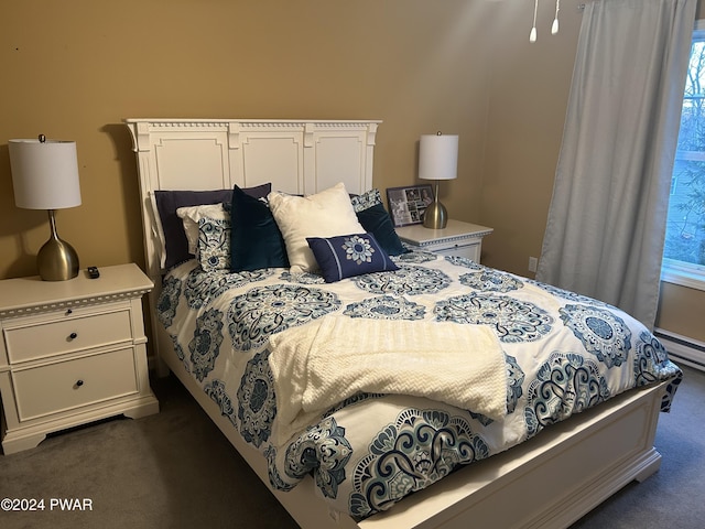 carpeted bedroom featuring a baseboard radiator