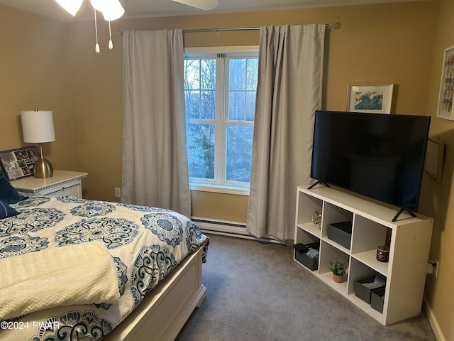 carpeted bedroom featuring ceiling fan and a baseboard radiator