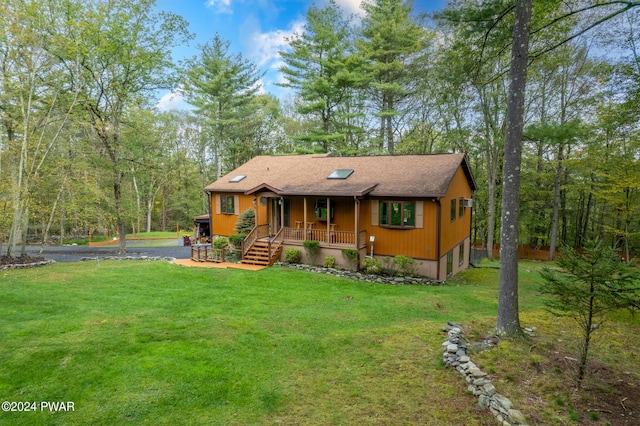 view of front of house with a front lawn and a porch