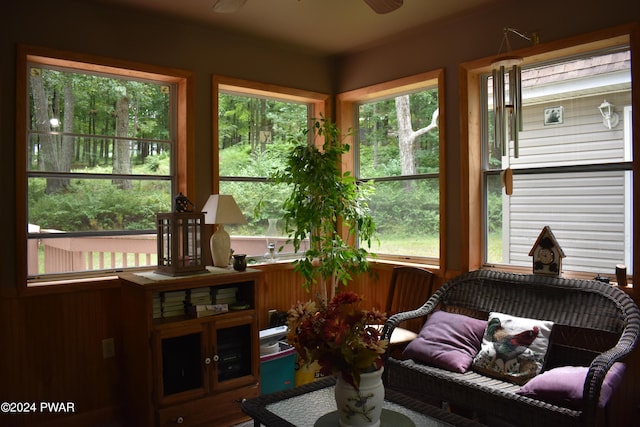 sunroom featuring ceiling fan