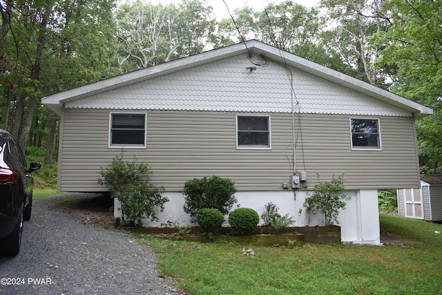 view of property exterior with a yard