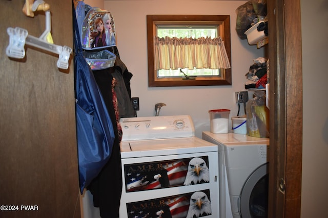 clothes washing area featuring independent washer and dryer