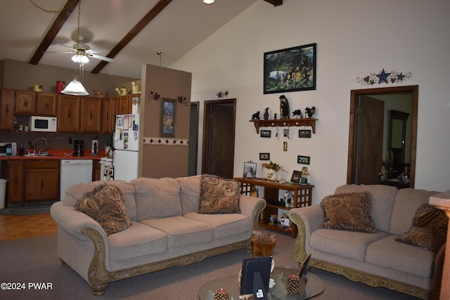 living room with beamed ceiling, ceiling fan, sink, and high vaulted ceiling