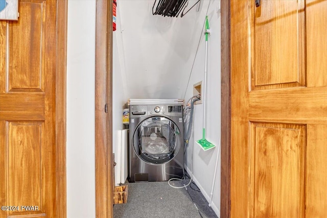 washroom with washer / clothes dryer