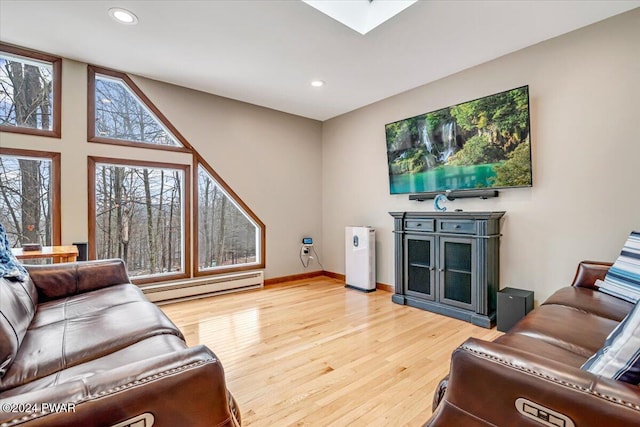 living room with hardwood / wood-style flooring and baseboard heating