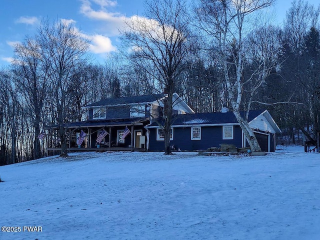 view of front of home featuring a garage and covered porch