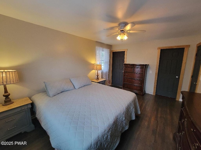 bedroom featuring dark wood-type flooring and a ceiling fan